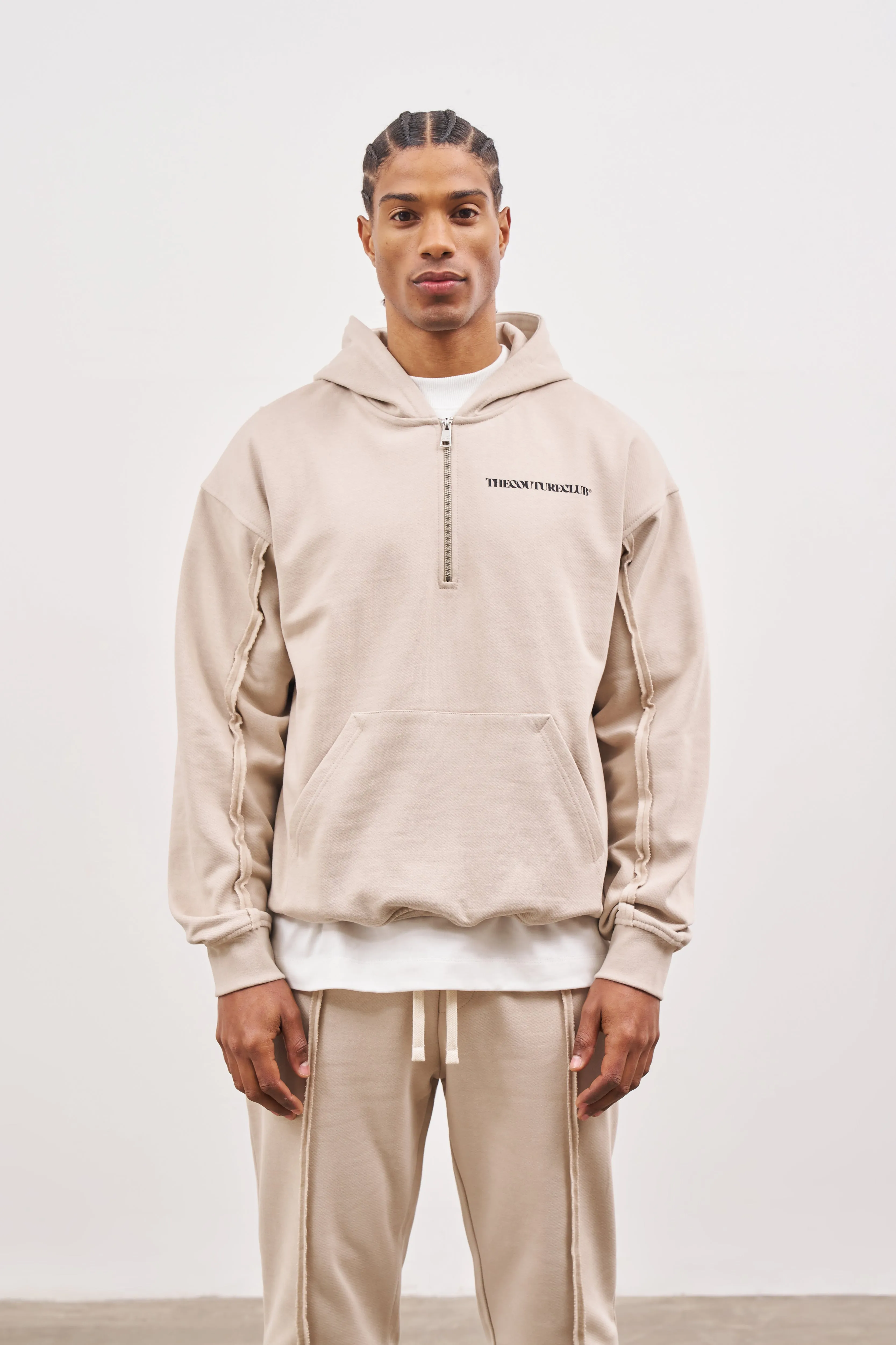 RAW SEAM QUARTER ZIP HOODIE - BEIGE