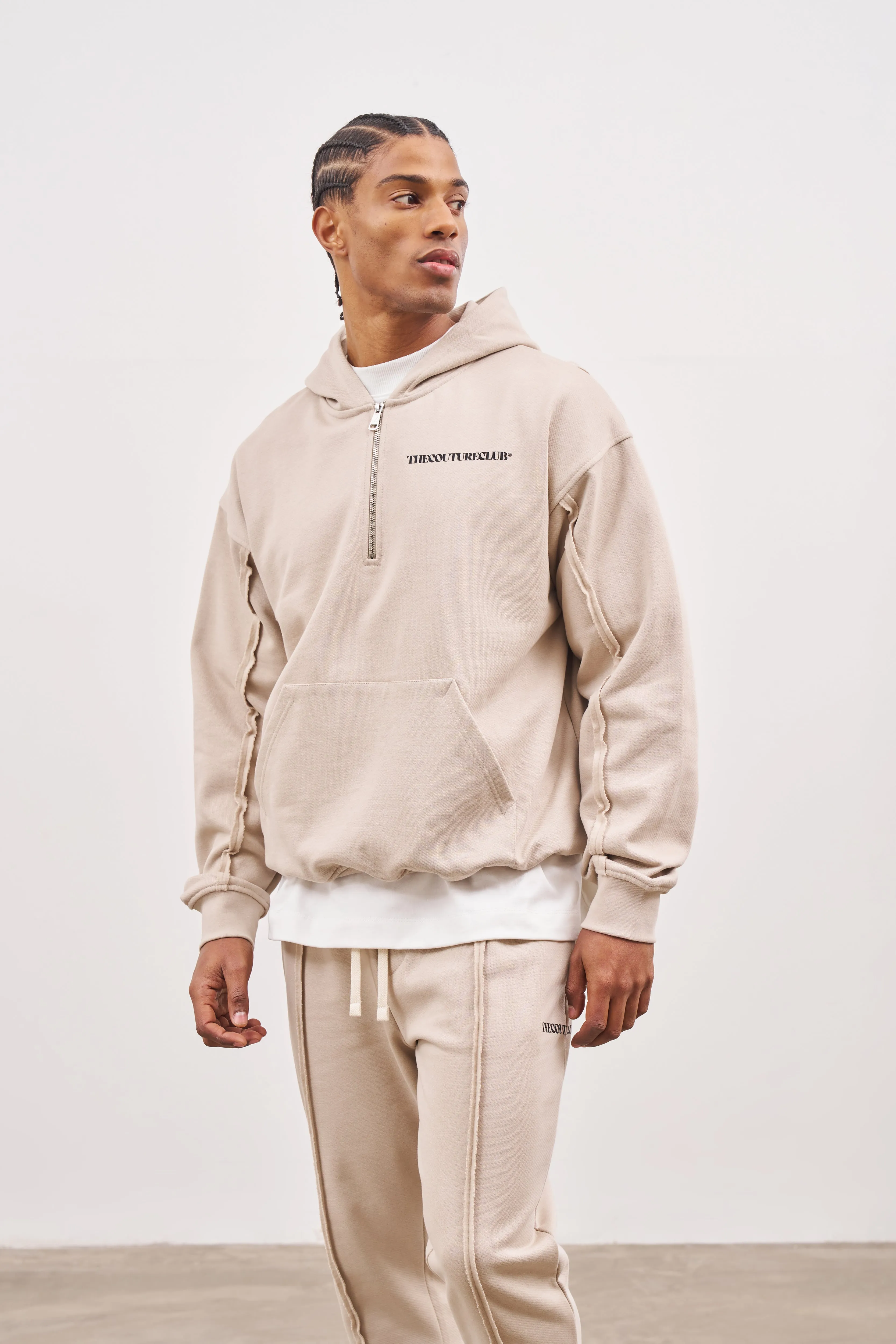 RAW SEAM QUARTER ZIP HOODIE - BEIGE